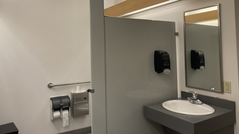 Bathroom view of sink and stall.