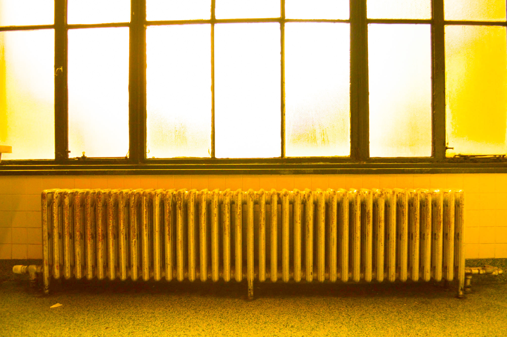 Radiator with bright orange overlay indicating warmth on top.